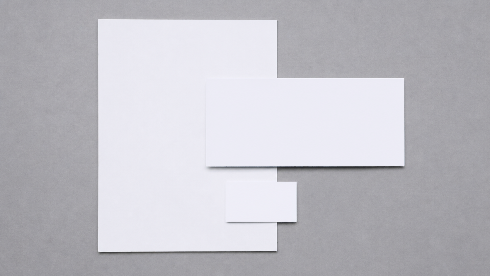 Three unprinted stationery pieces retaining their original placement, depth and natural shadows
